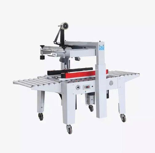 may dan bang keo thung carton ban tu dong hualian fxj-5050a (dung bang keo bopp) hinh 0